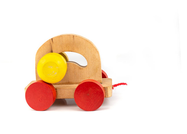 Colourfull wooden toy car on white background. - Foto, afbeelding