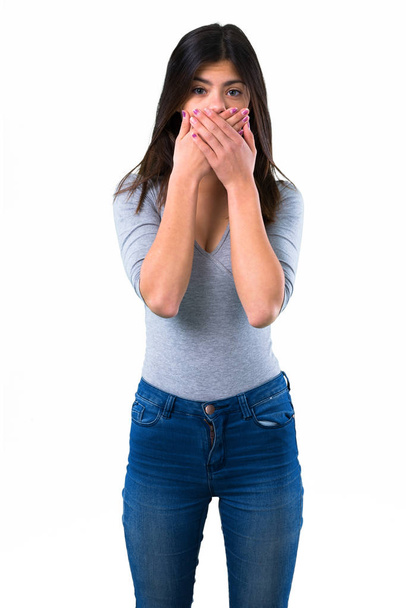 Teenager girl covering mouth with hands - Photo, image
