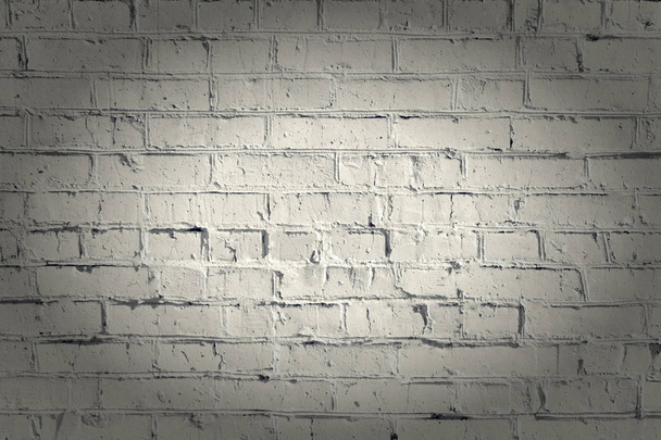 Painted brick wall. Empty beige background with vignette. The texture of the brickwork. - Photo, Image
