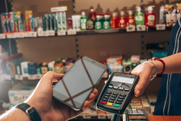 Purchase and payment for goods using NFC - Photo, Image