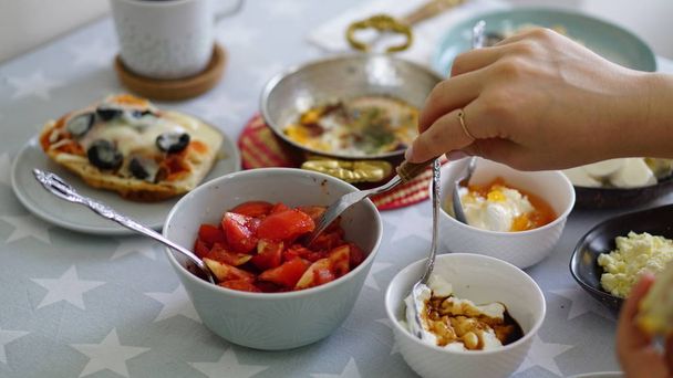 very rich morning breakfast. woman making a breakfast - Foto, Imagem