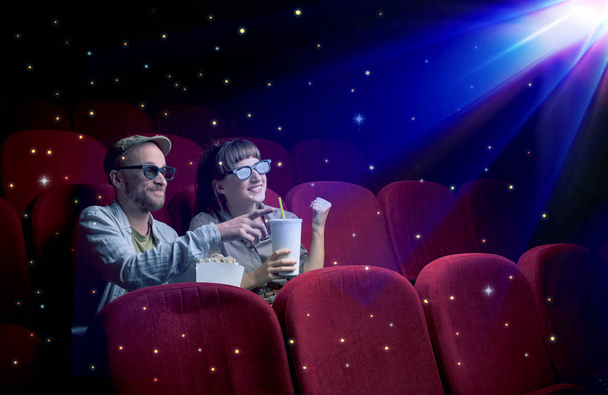 Lovely couple watching 3D movie - 写真・画像