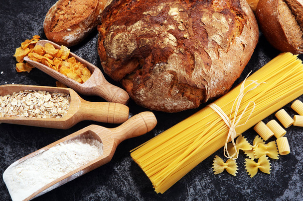 whole grain products with complex carbohydrates on rustic background - Photo, Image