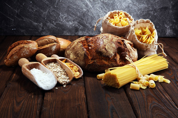 whole grain products with complex carbohydrates on rustic background - Photo, Image