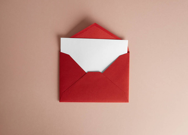 Mockup envelope and white blank sheet on empty color desk. Business empty mock-up background for message writing.Top view. Horizontal. - Foto, imagen