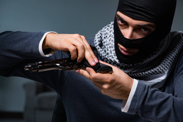Terrorist burglar with gun asking for money ransom - Photo, Image