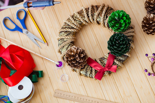 Woman doiing DIY festive decorations at home - Photo, Image