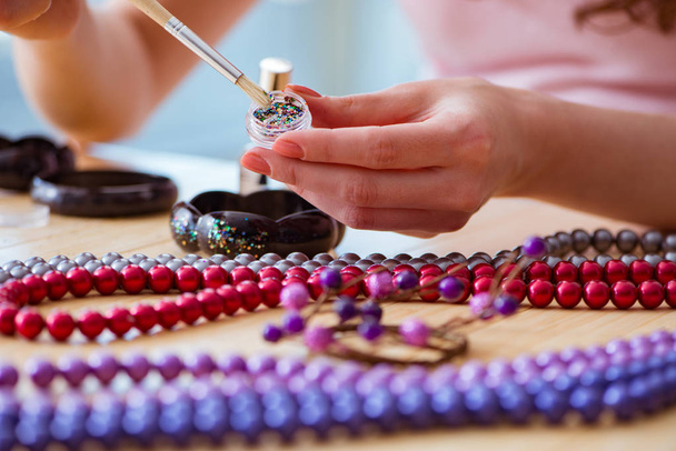 Woman making jewelry at home - Photo, Image