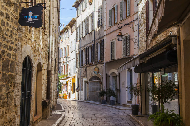 VENCE, FRANCE, on March 8, 2018. The typical city street of old stone houses characteristic of the small mountain town in Provence.  - Photo, image