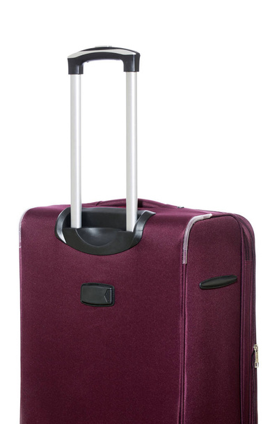 Reisekoffer mit ausziehbarem Griff auf weißem Hintergrund, Seitenansicht - Foto, Bild