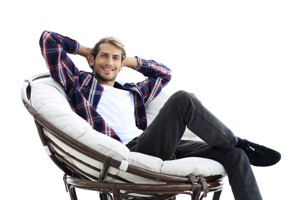 close-up. a successful guy sitting in a large round comfortable chair - Photo, image