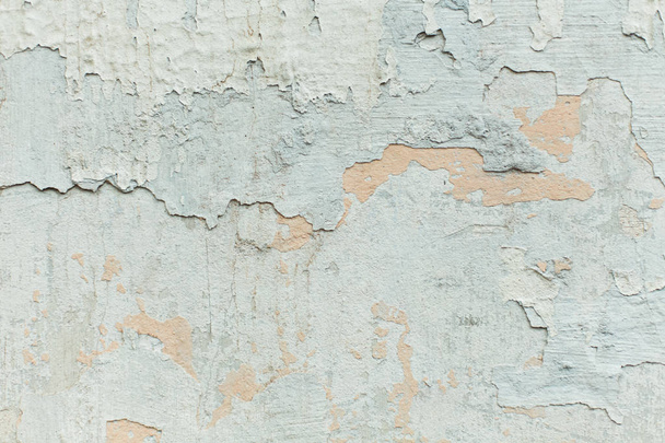 The texture of the mottled shabby wall, painted blue and gray plaster, abstract background close-up - Photo, Image