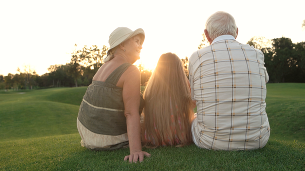 Seniors and grandchild on nature background. - Footage, Video