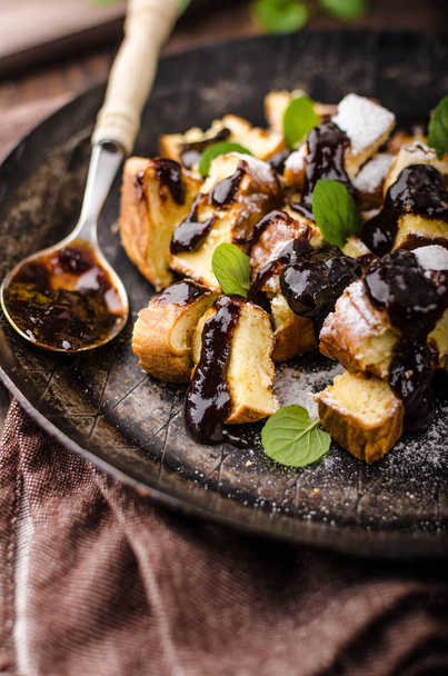 Cutted pancakes, Kaiserschmarrn delish dessert with plums, food photography, food stock - Foto, Bild