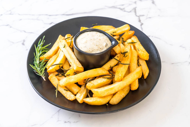 french fries with sauce - unhealthy food - Foto, Imagen