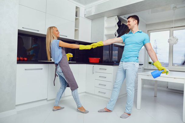A young couple is cleaning an apartment. - Photo, image