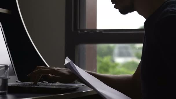 Busy male freelancer typing on laptop, finishing project, work deadline, stress - Filmagem, Vídeo