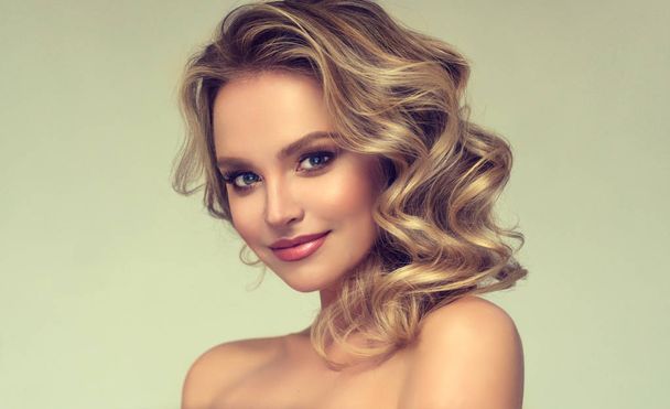 Beautiful model girl with  curly hair .blond head . Care products ,hair coloring  - Photo, Image