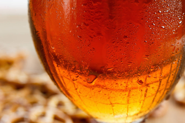 Glass of cold beer. Traditional pretzels german Oktoberfest snacks and drinks. - Photo, Image
