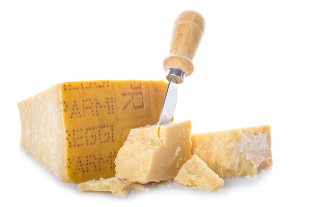 Aged parmesan cheese or parmigiano reggiano isolated on a white background - Photo, Image