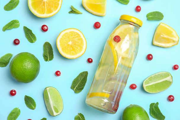 Flat lay composition with delicious natural lemonade on color background - Photo, image