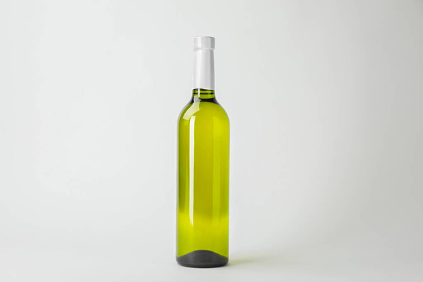 Bottle of expensive wine on white background - Фото, изображение