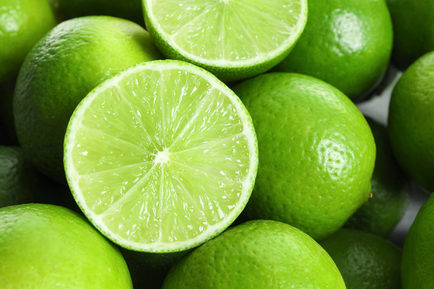 Fresh ripe green limes as background - Foto, Imagen