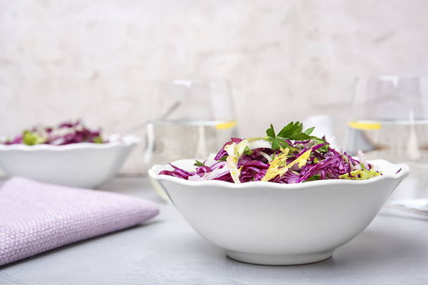 Bowl with chopped red cabbage on table - Photo, Image
