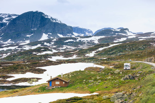 Tourism vacation and travel. Camper van motorhome on camping site rest place in norwegian mountains - Photo, image