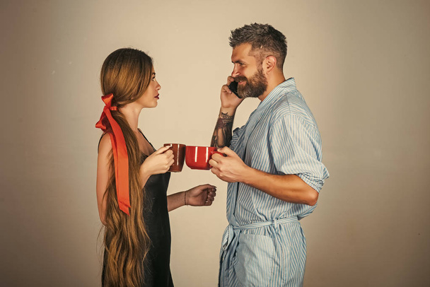 Passionate couple kissing, boy and girl. couple in love drink morning coffee or tea. - Fotó, kép