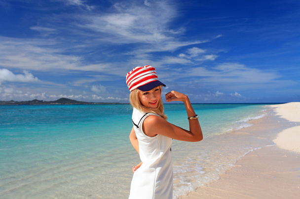 Young woman on the beach enjoy sunlight - Fotó, kép
