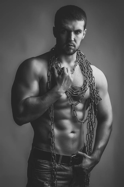 Face fashion boy or Man in your web site. Man face portrait in your advertisnent. Muscular man with rope - 写真・画像