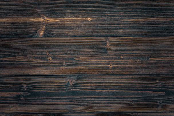 Dark brown wood texture with natural striped pattern for background, wooden surface for add text or design decoration art work - Foto, imagen