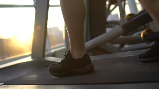 Sportsman running on treadmill, acceleration, progress, attainment of life goal - Πλάνα, βίντεο