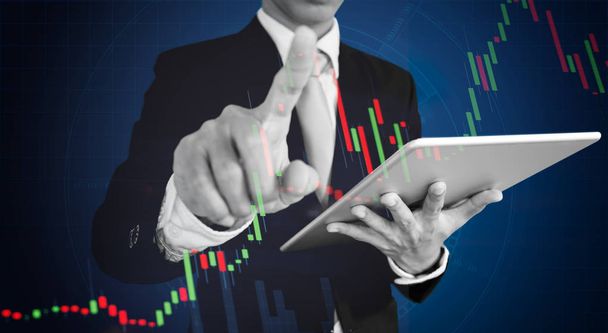 Businessman pointing finger on graph diagram. Business growth, investment and finance concept - Photo, Image