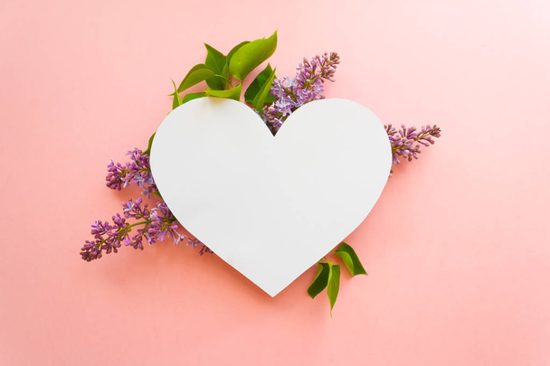 Heart frame with blossom lilac on pink background. Copy spase - Photo, Image