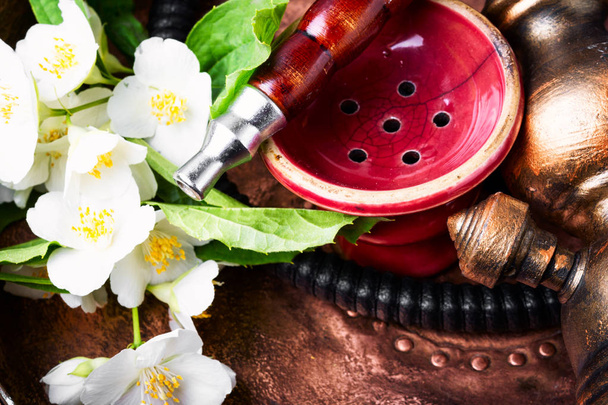 exotic hookah with jasmine floral scent.Shisha concept.Modern hookah - Photo, Image