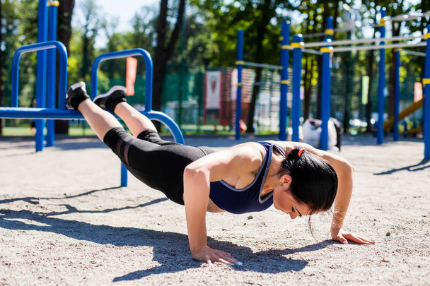 young sportive trainer on sport playground - Foto, Imagen