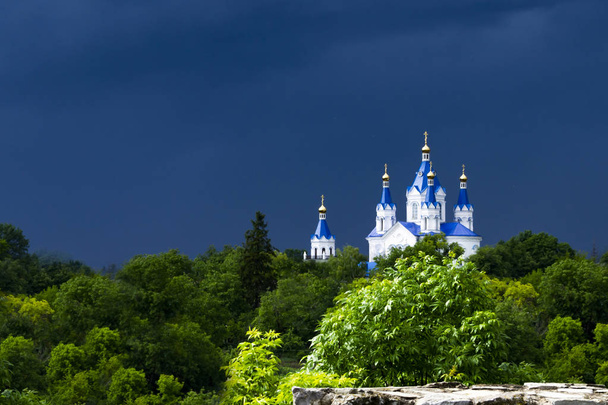 Eastern orthodox church against deep blue sky. Rainy spring day. Sun bright - Photo, Image