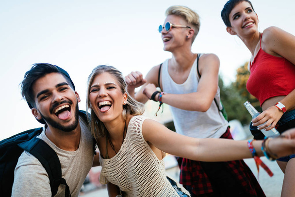 Happy young friends having fun at music festival - Foto, Imagen