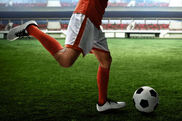 Soccer player kicking ball - Fotoğraf, Görsel