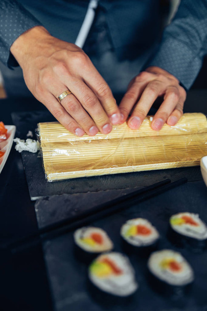 Sushi On A Plate Being Rolled - Foto, immagini