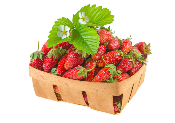 strawberry in a basket with leaves on a white background - Photo, Image