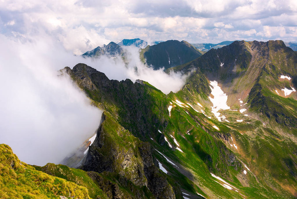clouds rising in Fagaras mountains. beautiful summer scenery of Southern Carpathians - Фото, изображение