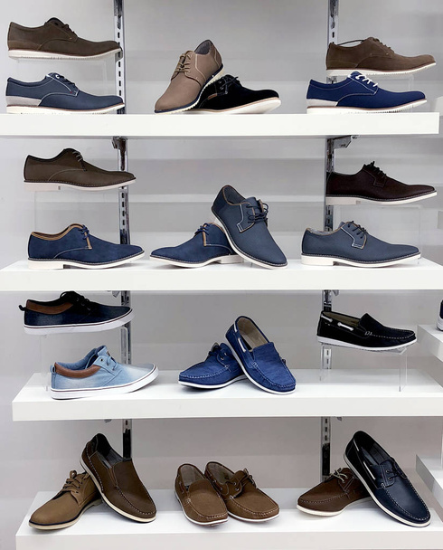 Background with male shoes on shelves of shop - Photo, Image