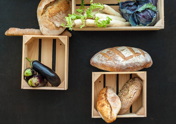 Vegetables and bread in wooden boxes. Autumn composition. Farm Products - Photo, Image