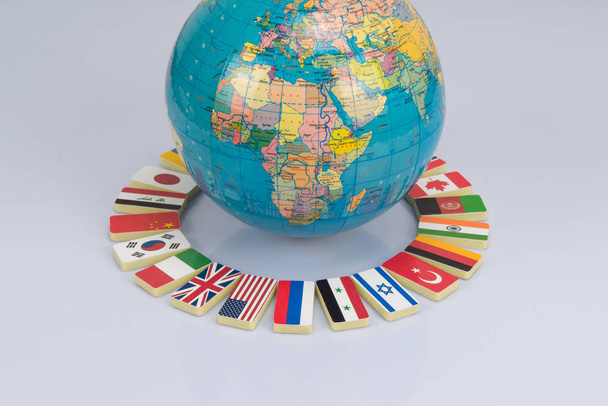 Глобус з прапорами світу. Концептуальна фотографія, світова спільнота
 - Фото, зображення