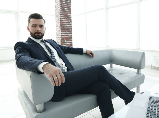 businessman sitting in the lobby of a modern office. - 写真・画像