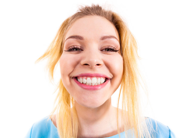Bizarre close up of joyful happy woman. Smiling funny female face captured in fish eye. - Φωτογραφία, εικόνα
