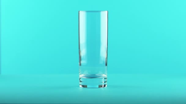 4K close-up shot of fizzy cola soda cold beverage drink pooring into glass blue background in studio - Footage, Video